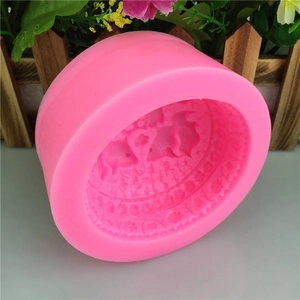 Pink silicone mold featuring fish and floral patterns for soap and cake making