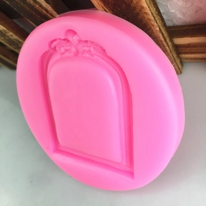 Pink silicone mold featuring an ornate retro floral arched frame for fondant cake decorating