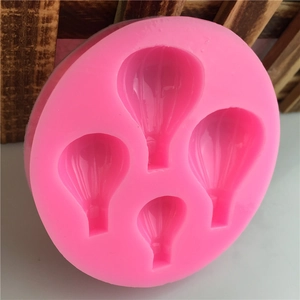 Pink silicone mold with four different hot air balloon cavities for cake decorating