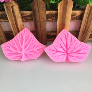 Pink leaf-shaped liquid silicone mold set with detailed vein texture for DIY fondant cakes