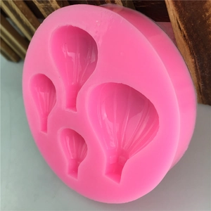 Pink silicone mold with four hot air balloon shapes for DIY chocolate and cake decoration