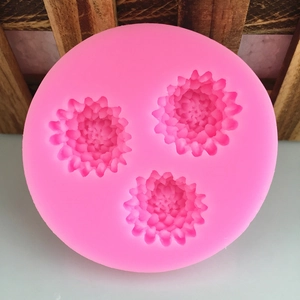 Pink circular silicone mold with 3 cavities featuring detailed flower petal designs