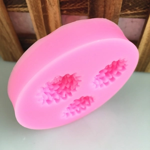 Pink silicone mold with three pinecone flower shapes for DIY fondant cake decorating