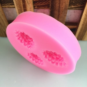 Pink silicone mold with three pinecone flower cavities for DIY fondant and cake decorating