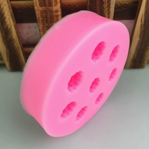 Pink silicone round mold with seven berry shaped cavities for DIY chocolate and fondant