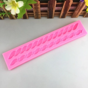 Pink silicone mold featuring dual spiral rope patterns for fondant and chocolate baking