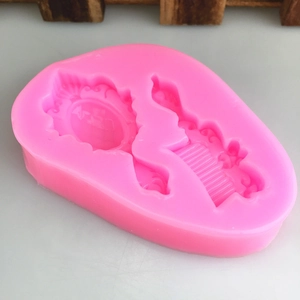 Pink silicone mold featuring vintage mirror and comb shapes for DIY cake fondant and crafts