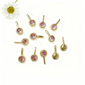 Detailed set of eleven gold-plated round pendants with pink cubic zirconia stones