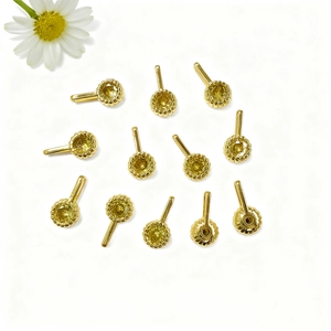 Macro detail of twelve gold-plated round zircon settings for DIY jewelry making
