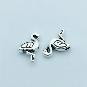 Pair of flamingo animal charms in silver metal finish for DIY jewelry connectors