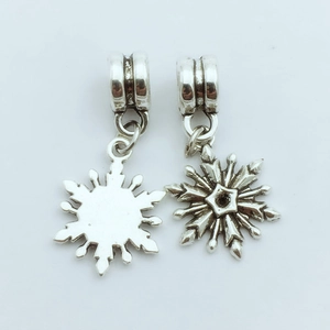 Vintage silver snowflake pendant charms for jewelry making showing front and back details
