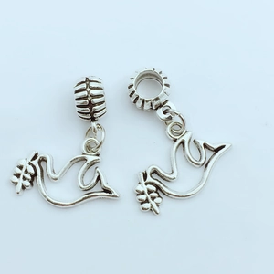 Vintage silver peace dove charms with olive branch detail for DIY jewelry making