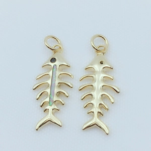 Gold plated fishbone pendant featuring colorful opal inlay and minimalist hollow design