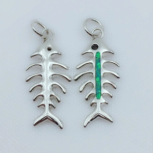 Detail of 18k gold plated fishbone pendants with green opal inlay and silver finish