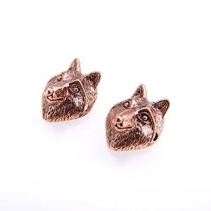 Detail of vintage wolf head beads for DIY jewelry with antique bronze finish