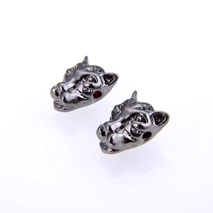 Macro detail of gunmetal leopard head charm with intricate texture for jewelry making
