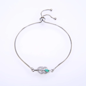 Detail of silver leaf bracelet with micro-pave cubic zirconia and green fire opal