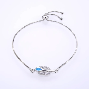Detail of adjustable leaf bracelet with blue opal stone and micro-pave zircons