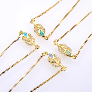 Gold leaf bracelets set with opal and cubic zirconia on elegant box chains