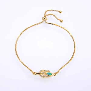 Macro detail of leaf-shaped bracelet with green opal and adjustable bolo clasp