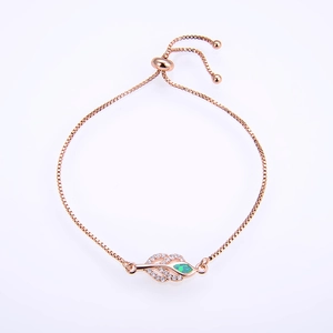 Detail of rose gold leaf bracelet with opal stone and zirconia on a box chain