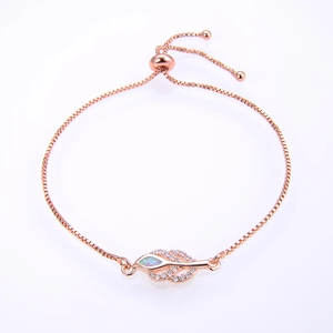Detail of rose gold adjustable opal leaf bracelet with pavé cubic zirconia accents