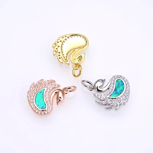 Elegant swan pendant in opal and zircon, available in gold, rose gold and silver finish