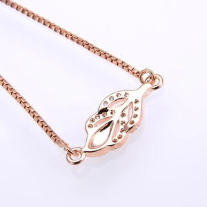 Rose gold box chain bracelet with leaf pendant featuring micro-set white cubic zirconia