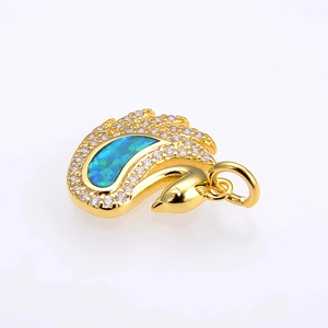 Detailed close-up of a swan pendant with blue opal stone and micro-set white cubic zirconia