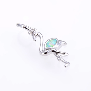 Elegant silver flamingo pendant with shimmering marquise opal stone inlay on white background
