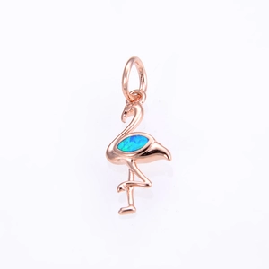 Detailed close-up of flamingo pendant with rose gold finish and blue opal stone inlay