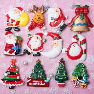 Assorted Christmas resin cabochons featuring Santa and Reindeer for DIY crafts