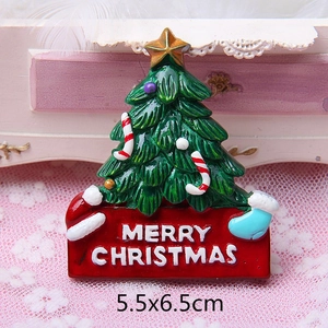 Detail view of a 3D resin Christmas tree magnet with Merry Christmas text on a red base