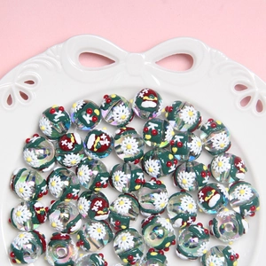 Macro view of Christmas themed beads with snowflake patterns in a white porcelain dish