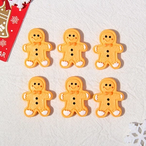 Detailed macro view of 6 pieces resin gingerbread man charms for DIY holiday crafts projects