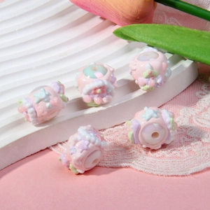 Pastel macaron beads with floral and heart relief patterns for DIY jewelry making