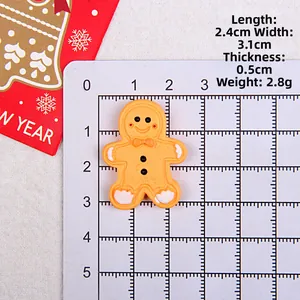 Resin Christmas gingerbread man DIY accessory shown with size scale measurements