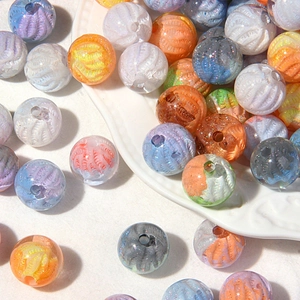 Macro detail of textured oil-painting style acrylic beads with glitter and spiral relief