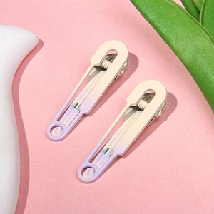 Detail of sweet gradient hair clips in cream and purple with durable metal springs