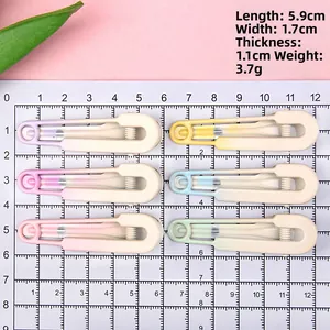 Gradient hair clips in six colors on a grid mat showing 5.9cm size and 3.7g weight