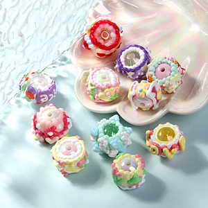 Macro view of colorful multi-layered oil painted cake-shaped DIY resin beads