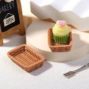 Miniature dollhouse bakery scene with resin cupcakes and woven texture bread baskets