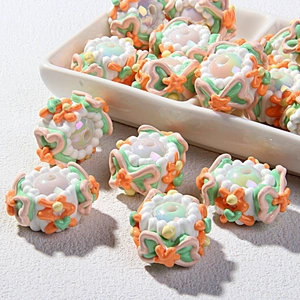 Detail of floral beaded charms for DIY jewelry with colorful hand-painted patterns
