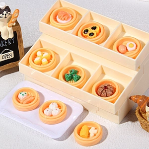 Miniature resin dim sum set with steamed buns and dumplings on a three-tier display stand