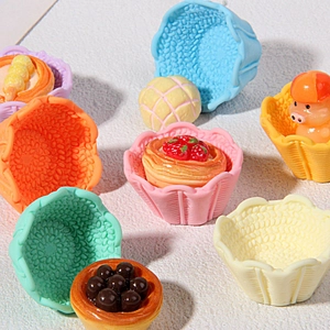 Colorful resin fruit basket miniatures and DIY food play toys on white background