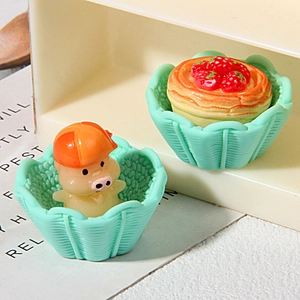 Miniature resin pig and strawberry tart figures in mint green woven baskets decor