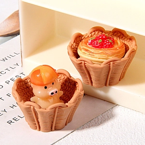 Miniature resin basket charms featuring a pink pig and strawberry tart for DIY crafts