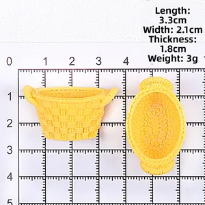 Miniature yellow resin basket model with 3.3x2.1x1.8cm scale measurements on grid