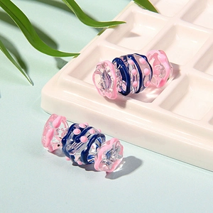 Perle en verre en forme de bonbon avec spirale bleue pour bijoux faits à la main