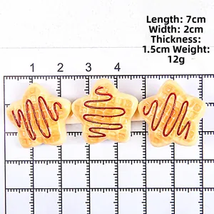 Detail shot of a star-shaped waffle hair clip with syrup on a white grid ruler base